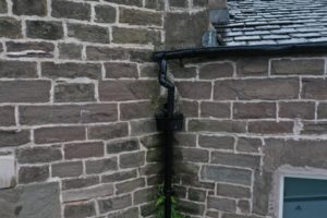 Insufficient guttering allows water to leak onto stonework