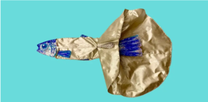 A shiny blue fish wearing a golden dress